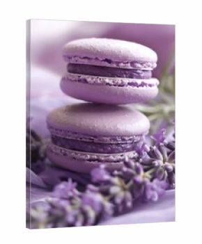 Delicious lavender macarons delicately stacked, surrounded by fresh lavender flowers, creating a dreamy pastel aesthetic.