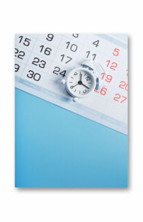 Alarm clock and calendar on a blue background
