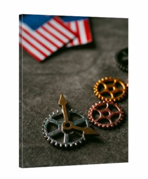 cogwheels, clock hands and american flags