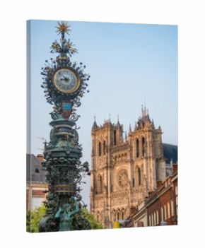 Amiens, France/07,26,2018:  View of the Dewailly clock in Amiens with the Cathedral in the background