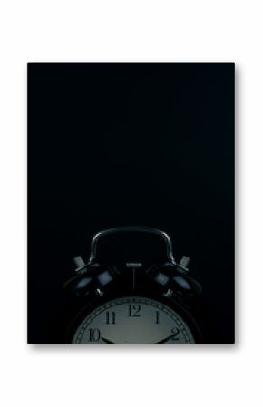 Time is up - alarm clock standing isolated on black background