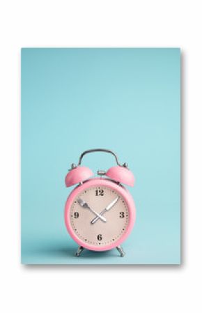 Alarm clock. Fork and knife instead of clock hands. Concept of intermittent fasting, lunchtime, diet and weight loss