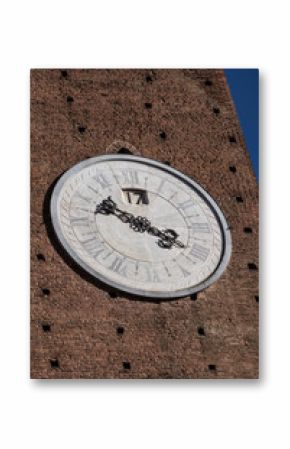 Massive wall clock on a brick tower in Siena, Italy 