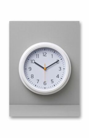 Modern round white wall clock with black numerals and orange second hand showing 10:10 time on blank gray background