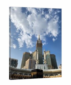 The image shows the Abraj Al Bait Towers, specifically the central tower known as the Makkah Clock Tower, in Mecca, Saudi Arabia. The scene captures pilgrims gathered in the courtyard of the Masjid al