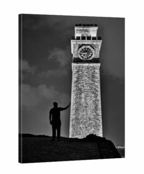 silhouette of a man with clock tower