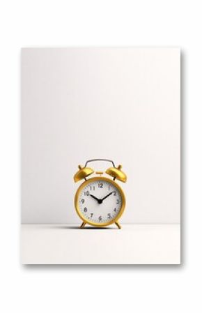 Vintage gold alarm clock on a white background