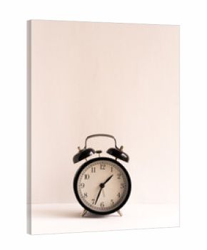 Retro alarm clock on wooden table Against White Background