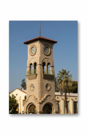Daytime view of a historic public clock tower in downtown Bakersfield, California, USA.