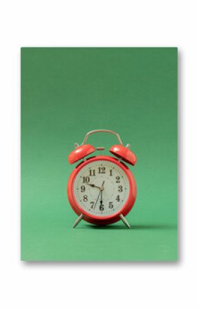 old red vintage table clock against pastel green background with shadow. Retro abstract art