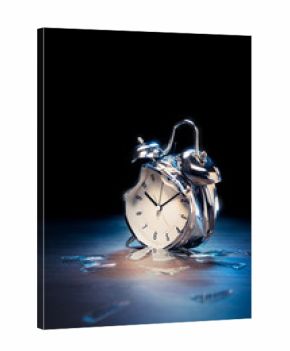 broken alarm clock with shattered glass on a dark background