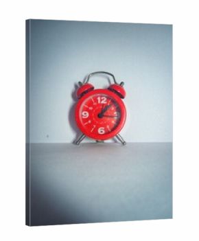 alarm clock on red background