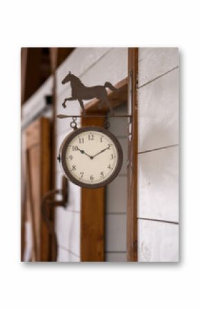 old farm clock on wooden wall