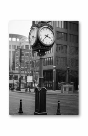 clock on the street in black and white