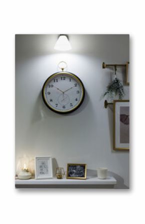 Elegant wall clock hanging above a white shelf
