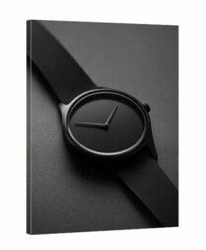 A timepiece featuring an entirely dark surface and lacking any markers for the hour.