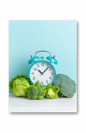 Mindful Nutrition Decoded Pastel Blue Retro Alarm Clock with Vibrant Green Vegetables - Intermittent Fasting, Wellness Timing and Metabolic Health Strategy