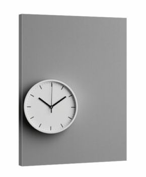 Round wall clock with a white face and black hands. the clock is mounted on a light grey wall. the hands of the clock are black and the numbers are in a simple, minimalist design.