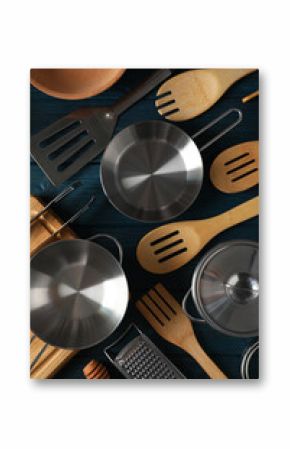 Different kitchen utensil on blue wooden background