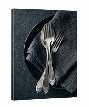 Old cutlery on kitchen towel. Top view. Copy space