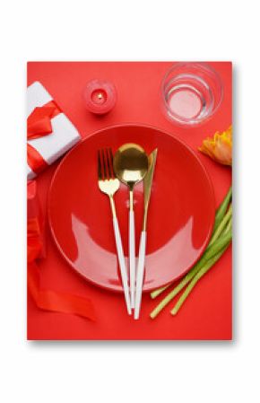 Beautiful table setting with cutlery on red background, closeup