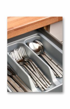 Silver cutlery placed in kitchen drawer