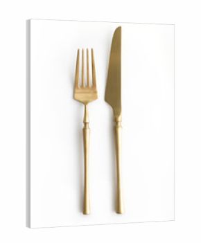 Golden cutlery view from above on a white background. Top view. Knife and fork for a festive table for a wedding, birthday or party.