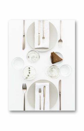 A dinner table for two with bread and cream cheese for starter, white wine and water to drink.
