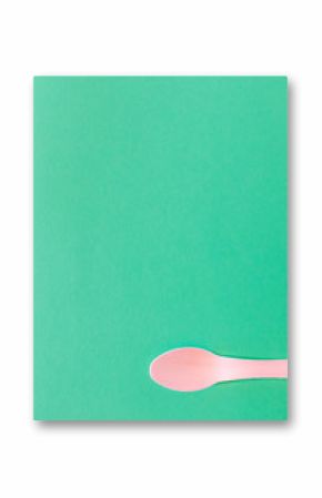 Spoon Cutlery on a bright green background. Eco-friendly wooden disposable cutlery on bright colored backdrop. Wallpapers for modern and ecological food. Plastic Free background for food banner