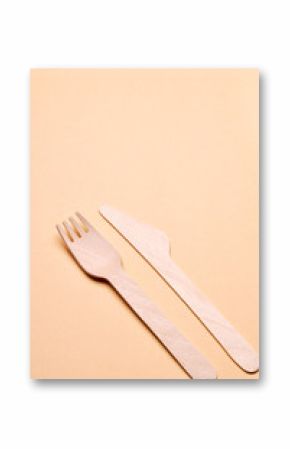 eco-friendly disposable utensils concept. bamboo or wooden cutlery over color background.