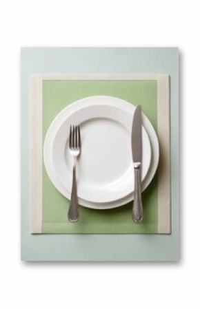 Dinner plate with fork and knife isolated on white background