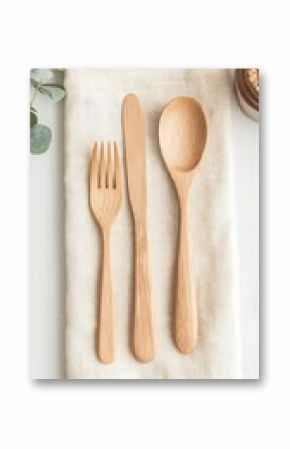 Elegant Bamboo Cutlery Set on Linen Napkin with Eucalyptus