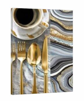 Gold cutlery and coffee cup on a grey and gold marble pattern tablecloth.