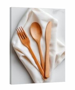 Wooden cutlery set on a white napkin