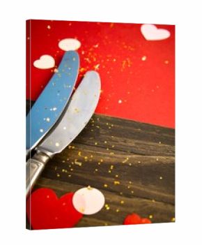 Valentine's Day cutlery on a wooden surface
