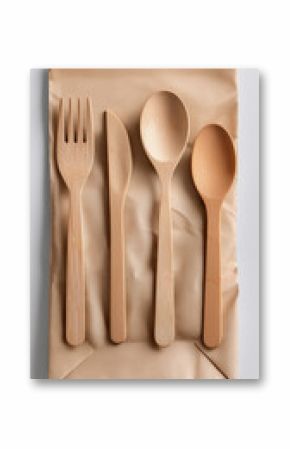Natural bamboo cutlery set on brown kraft paper fork