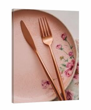 Rose-patterned plate with rose gold cutlery