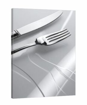 Polished silverware on a white plate