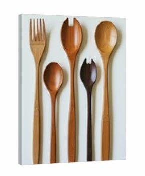 Wooden cutlery set arranged on a white surface