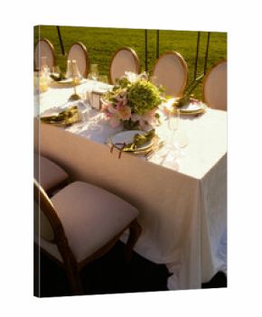 evening outdoor setup, golden hour outdoor celebration with exquisite floral decor and refined
