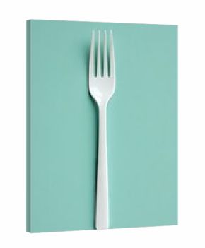 A striking flat lay of white plastic cutlery elegantly arranged against a vibrant blue background, showcasing culinary creativity and simplicity