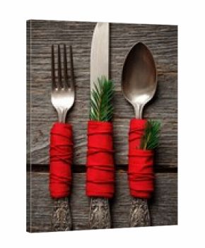 christmas table setting with cutlery and napkins on a wooden background