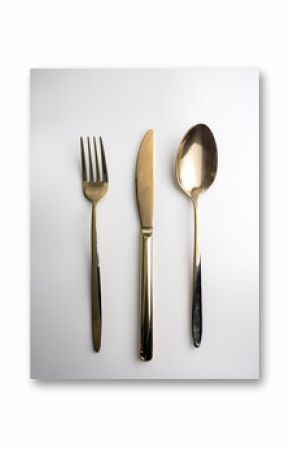 Fork, knife and spoon on white