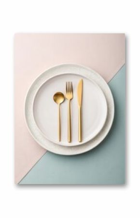 Minimalist flat lay of a white ceramic plate with golden cutlery on pastel backgrounds