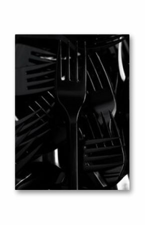 plastic disposable cutlery - black forks. lunch environmental problem