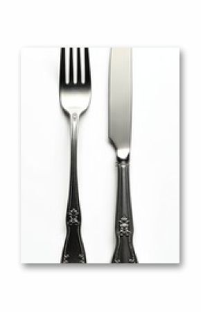 Isolated fork with knife cutlery set. Chrome silverware tableware for elegant kitchen dining. Shiny utensil on white background. Restaurant table setting object with luxury design. Flatware for