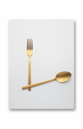Set of golden metal cutlery on white background