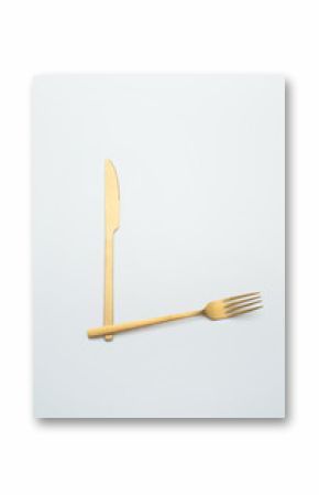 Set of golden metal cutlery on white background