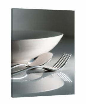 Fork and spoon on white marble texture background. Concept for food and dining tableware