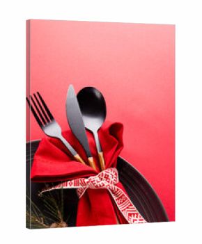 Image of christmas place setting with cutlery and copy space on red background